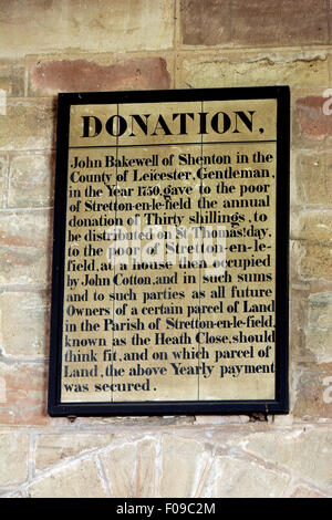 Donation board in St. Michael`s Church, Stretton-en-le-Field, Leicestershire, England, UK Stock Photo